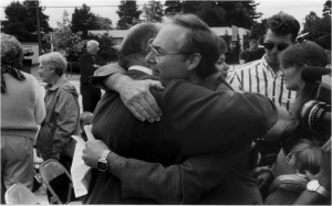 Pastor Rick hugging, George Keller, the arsonist's father 